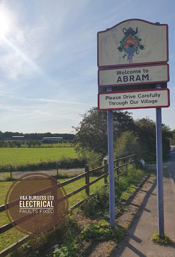 Abram village sign photographed by Electrical Faults Fixed