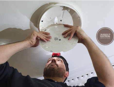 Electrician Repairing an issue with a light fitting - Electrical Faults Fixed