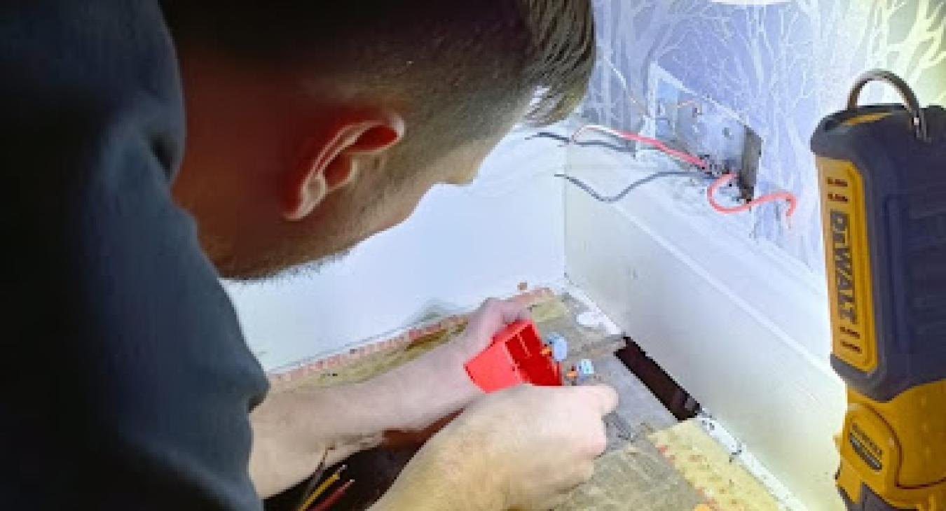 Electrician repairing a cable 